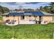 A well-appointed backyard with a patio, featuring a seating area and a grill for outdoor entertainment at 16816 E Costilla Ave, Foxfield, CO 80016