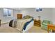 Charming bedroom with carpet floors, a side table, and a large window at 16816 E Costilla Ave, Foxfield, CO 80016