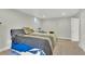 Cozy bedroom with carpet floors, a side table, and a large window at 16816 E Costilla Ave, Foxfield, CO 80016