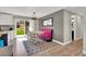 Bright dining space featuring a retro booth, modern lighting, and a view of the backyard at 16816 E Costilla Ave, Foxfield, CO 80016