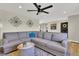 Bright living room with a neutral color palette, plush seating and decorative elements at 16816 E Costilla Ave, Foxfield, CO 80016