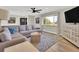 Comfortable living room featuring plush seating and a view of the outdoors at 16816 E Costilla Ave, Foxfield, CO 80016