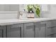 Bathroom sink with modern gray cabinetry and elegant faucet at 1750 Wewatta St # 1227, Denver, CO 80202