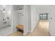 Modern bathroom featuring a stylish vanity and a convenient built-in bench and storage area at 1750 Wewatta St # 1227, Denver, CO 80202