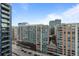 Exterior of a high-rise residential building in a bustling urban setting at 1750 Wewatta St # 1227, Denver, CO 80202