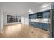 Open-concept kitchen featuring stainless steel appliances and hardwood flooring at 1750 Wewatta St # 1227, Denver, CO 80202
