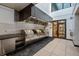 Stainless outdoor kitchen featuring a row of grills, counter space, and convenient access to the interior at 1750 Wewatta St # 1227, Denver, CO 80202