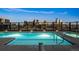 Rooftop pool and spa with a stunning skyline view, perfect for urban relaxation and entertainment at 1750 Wewatta St # 1227, Denver, CO 80202