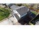 View of the home's roof, patio, and backyard area surrounded by a wooden fence at 12173 W 68Th Ave, Arvada, CO 80004