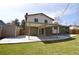 Expansive backyard featuring a large patio and a storage shed at 12173 W 68Th Ave, Arvada, CO 80004