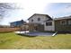 Green backyard, partially brick, with an open patio and new covered space at 12173 W 68Th Ave, Arvada, CO 80004
