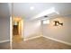 Finished basement with neutral walls, carpeted floors, and mounted TV bracket at 12173 W 68Th Ave, Arvada, CO 80004
