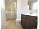 Contemporary bathroom with a walk-in shower and stylish vanity at 12173 W 68Th Ave, Arvada, CO 80004