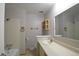 Bright bathroom with a tub/shower combo, large mirror and vanity at 12173 W 68Th Ave, Arvada, CO 80004