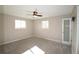 Spacious bedroom featuring a modern ceiling fan and light-filled windows at 12173 W 68Th Ave, Arvada, CO 80004