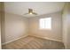 A simple bedroom has neutral walls, newer carpet and a ceiling fan at 12173 W 68Th Ave, Arvada, CO 80004