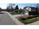 Street view of a two-story home with a well-manicured front yard at 12173 W 68Th Ave, Arvada, CO 80004