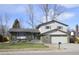 Charming two-story home with a well-maintained front yard and attached two-car garage at 12173 W 68Th Ave, Arvada, CO 80004