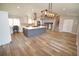Spacious kitchen featuring a large center island, modern lighting, and updated stainless appliances at 12173 W 68Th Ave, Arvada, CO 80004