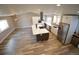Open concept kitchen with large island and stainless steel appliances at 12173 W 68Th Ave, Arvada, CO 80004