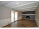 Living area with a fireplace and sliding doors leading to an outdoor patio at 12173 W 68Th Ave, Arvada, CO 80004