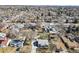 Expansive aerial view of a neighborhood showcasing a mix of home styles and mature trees at 4546 S Logan St, Englewood, CO 80113