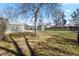 Large backyard with mature trees, storage shed, and a fenced perimeter, offering privacy and space for outdoor activities at 4546 S Logan St, Englewood, CO 80113