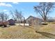 A backyard with a shed and landscaping, mostly dormant in late fall, early spring, and partially fenced at 4546 S Logan St, Englewood, CO 80113