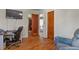 Bedroom featuring a closet, hardwood floors, and a comfortable chair at 4546 S Logan St, Englewood, CO 80113