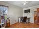 Office space featuring hardwood floors, a built-in desk, and a large window at 4546 S Logan St, Englewood, CO 80113