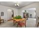 Bright dining area featuring a classic chandelier and seamless transition to the living spaces at 4546 S Logan St, Englewood, CO 80113