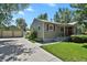 Charming single-Gathering home with a lush green lawn, private yard and detached garage at 4546 S Logan St, Englewood, CO 80113