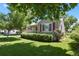 Quaint single-story home with manicured lawn and mature landscaping at 4546 S Logan St, Englewood, CO 80113