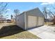 Two-car detached garage with an adjacent fenced yard provides a convenient parking and storage solution at 4546 S Logan St, Englewood, CO 80113