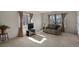 Cozy living room with large windows, neutral carpeting, and comfortable seating at 4546 S Logan St, Englewood, CO 80113