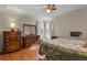 Inviting primary bedroom featuring wood floors, neutral walls, and ample natural light at 4546 S Logan St, Englewood, CO 80113