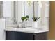 Bathroom with double vanity and marble countertop at 5524 Uinta St, Denver, CO 80238