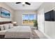 Spacious bedroom with large windows and a ceiling fan at 5524 Uinta St, Denver, CO 80238