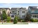 Two-story craftsman style home with solar panels and landscaped yard at 5524 Uinta St, Denver, CO 80238