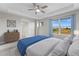 Main bedroom with large windows and views of the backyard at 5524 Uinta St, Denver, CO 80238