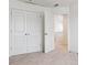 Spacious bedroom with double doors and carpeting at 693 N Tempe St, Aurora, CO 80018