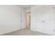 Bedroom with door to hallway and double door closet at 693 N Tempe St, Aurora, CO 80018