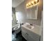 Bathroom with vanity, toilet, and shower/tub combination at 11449 E 1St Ave, Aurora, CO 80010