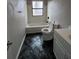 Bathroom with tub/shower combo, toilet, and vanity at 11449 E 1St Ave, Aurora, CO 80010