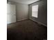 Cozy bedroom with a window, neutral paint, and plush carpeting for warmth and comfort at 11449 E 1St Ave, Aurora, CO 80010