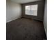 Bedroom with neutral walls, carpet, and a window at 11449 E 1St Ave, Aurora, CO 80010