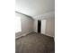 Bright bedroom featuring plush carpeting, a window for natural light, and a closet for storage at 11449 E 1St Ave, Aurora, CO 80010