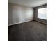 Bedroom with neutral walls, carpet, and a window at 11449 E 1St Ave, Aurora, CO 80010