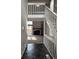 Inviting foyer with staircase, tile entry, and a glimpse into the living room with a fireplace at 11449 E 1St Ave, Aurora, CO 80010