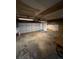 Attached garage with overhead lighting and door at 11449 E 1St Ave, Aurora, CO 80010